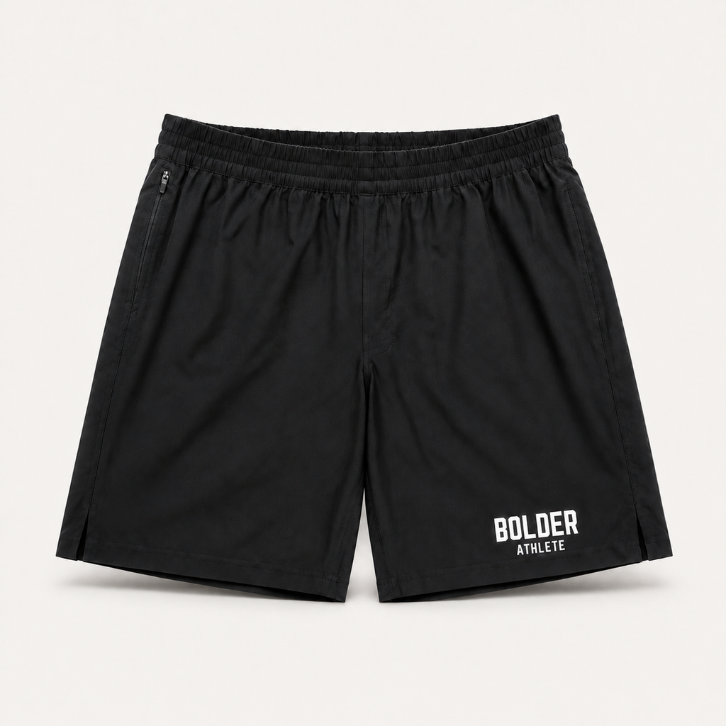 Black Bolder x Alpha Toro training shorts, front view on light studio background