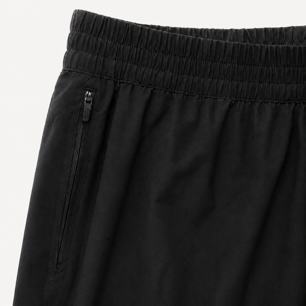 Black Bolder x Alpha Toro training shorts waistband and zip pocket detail on light studio background