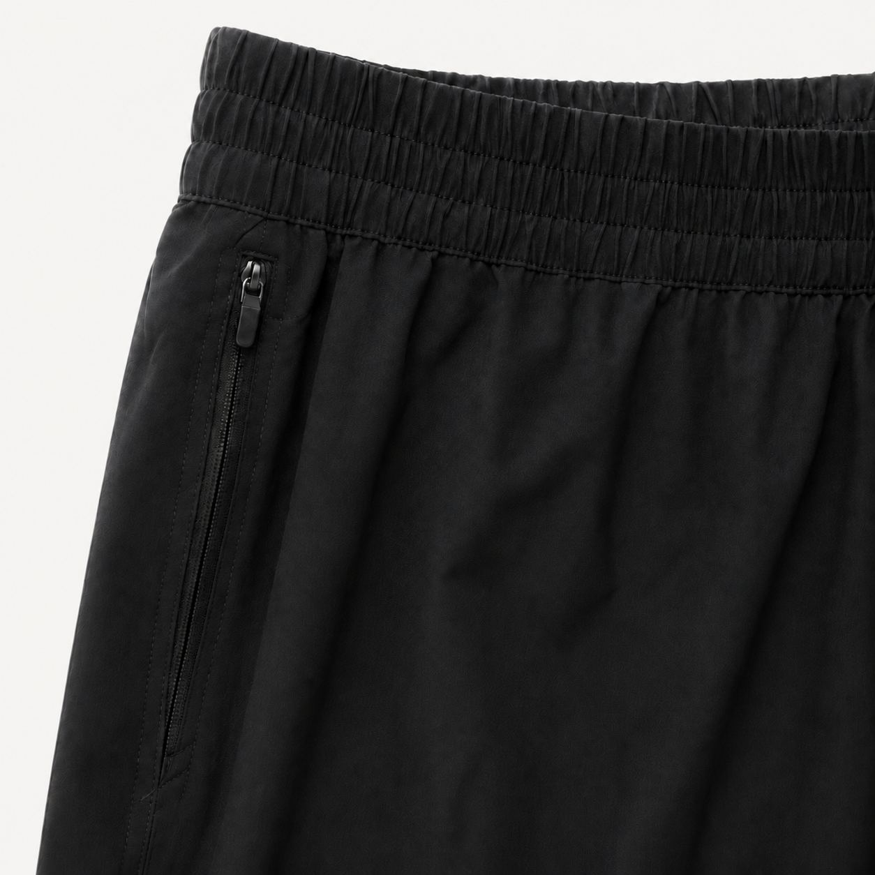 Black Bolder x Alpha Toro training shorts waistband and zip pocket detail on light studio background